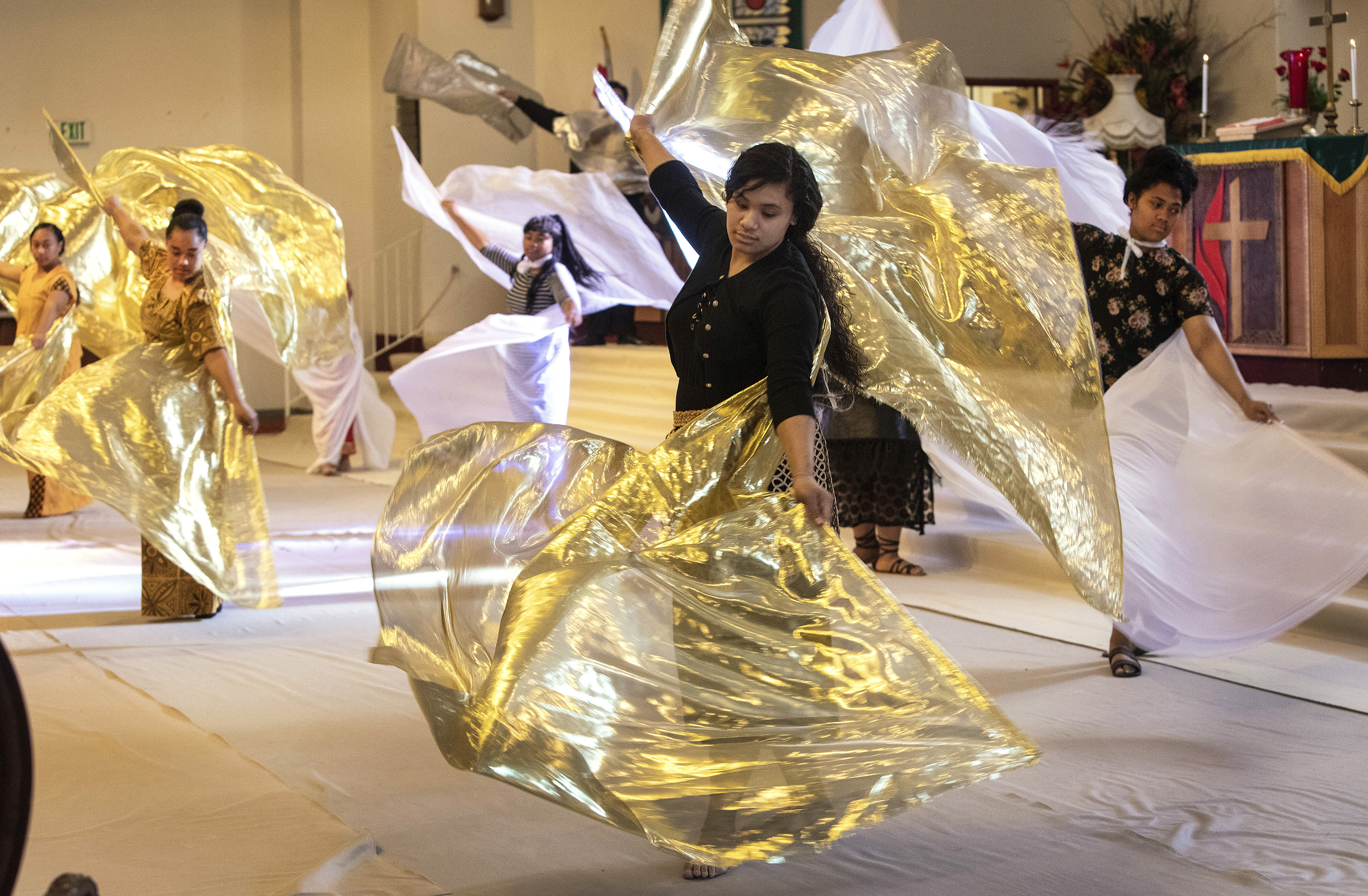 Sepi Lokotui dances during the Sunday service of the Tongan United Methodist Church in West Valley City, Utah, where the youth in high school and junior high worship actively through music and dance. 