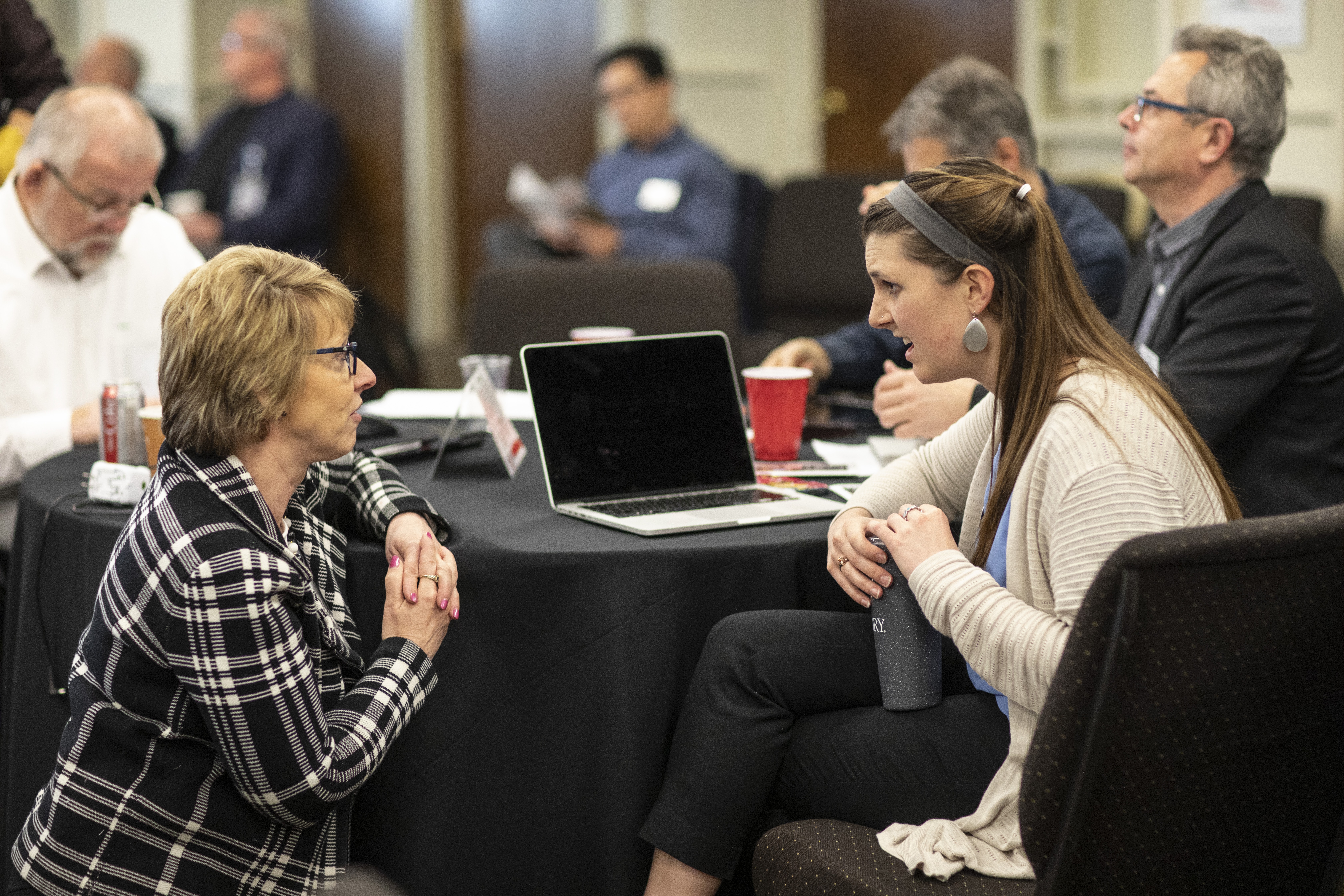 Judi Kenaston, Northeastern Jurisdiction, talks with Michelle Hettman, Southeastern Jurisdiction, during the meeting of the Connectional Table held at United Methodist Discipleship Ministries in Nashville, Tenn., April 2.  Photo by Kathleen Barry, UMNS