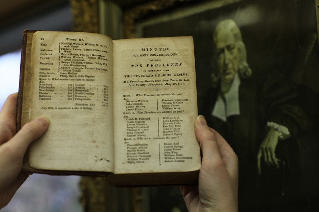 Archivist-Records Administrator, Frances Lyons-Bristol, holds a book of listing early Methodists including circuit rider the Rev. Freeborn Garrettson, one of thousands of historic items and documents housed at the General Commission on Archives and History at Drew University in Madison, New Jersey. Journals courtesy of the General Commission on Archives and History of the United Methodist Church. Photo by Kathleen Barry, UMNS.