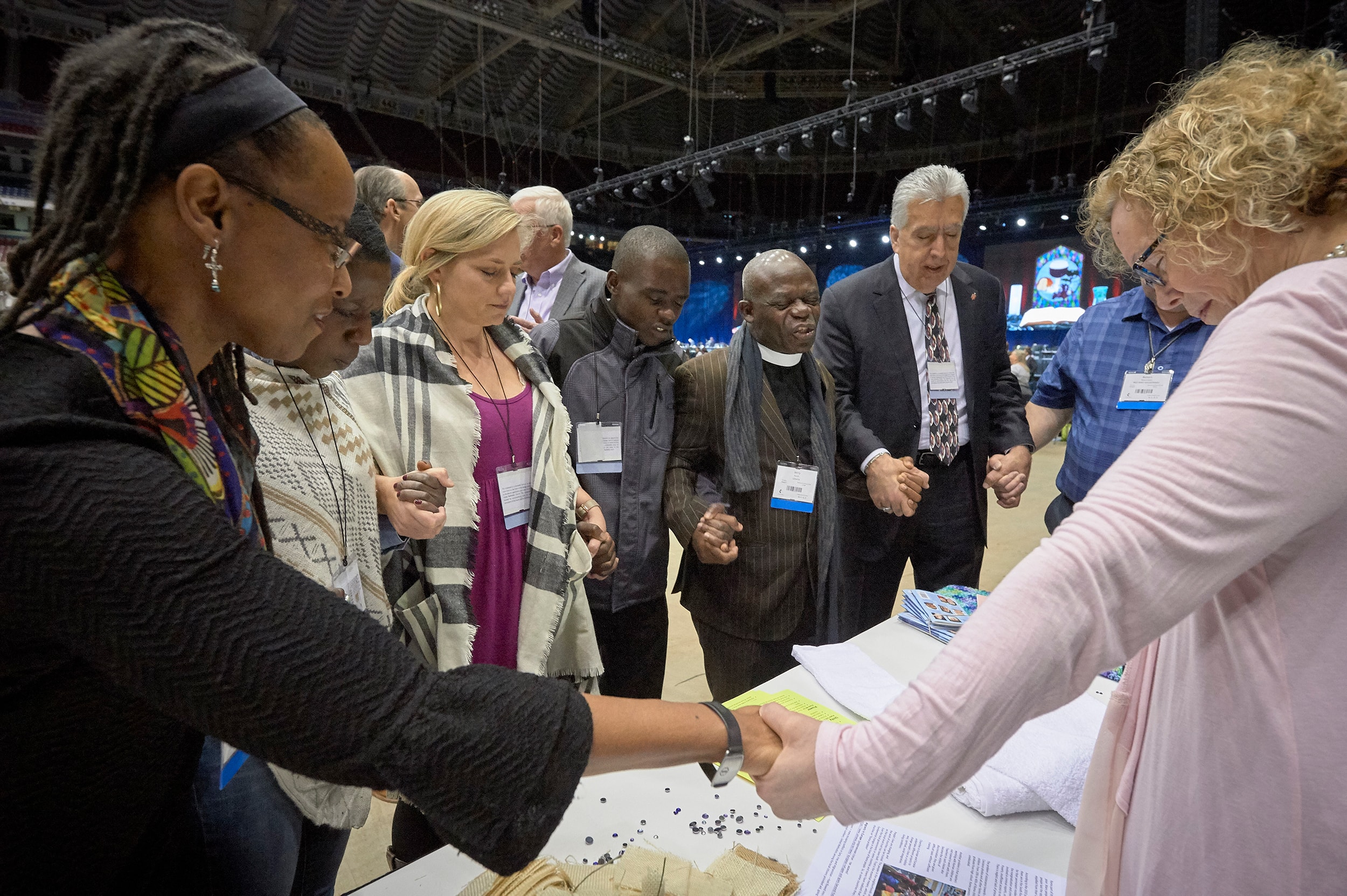 Delegates pray together during the February 23, 2019, opening session of the Special Session of the General Conference of The United Methodist Church. Photo by Paul Jeffrey for United Methodist News Service.
