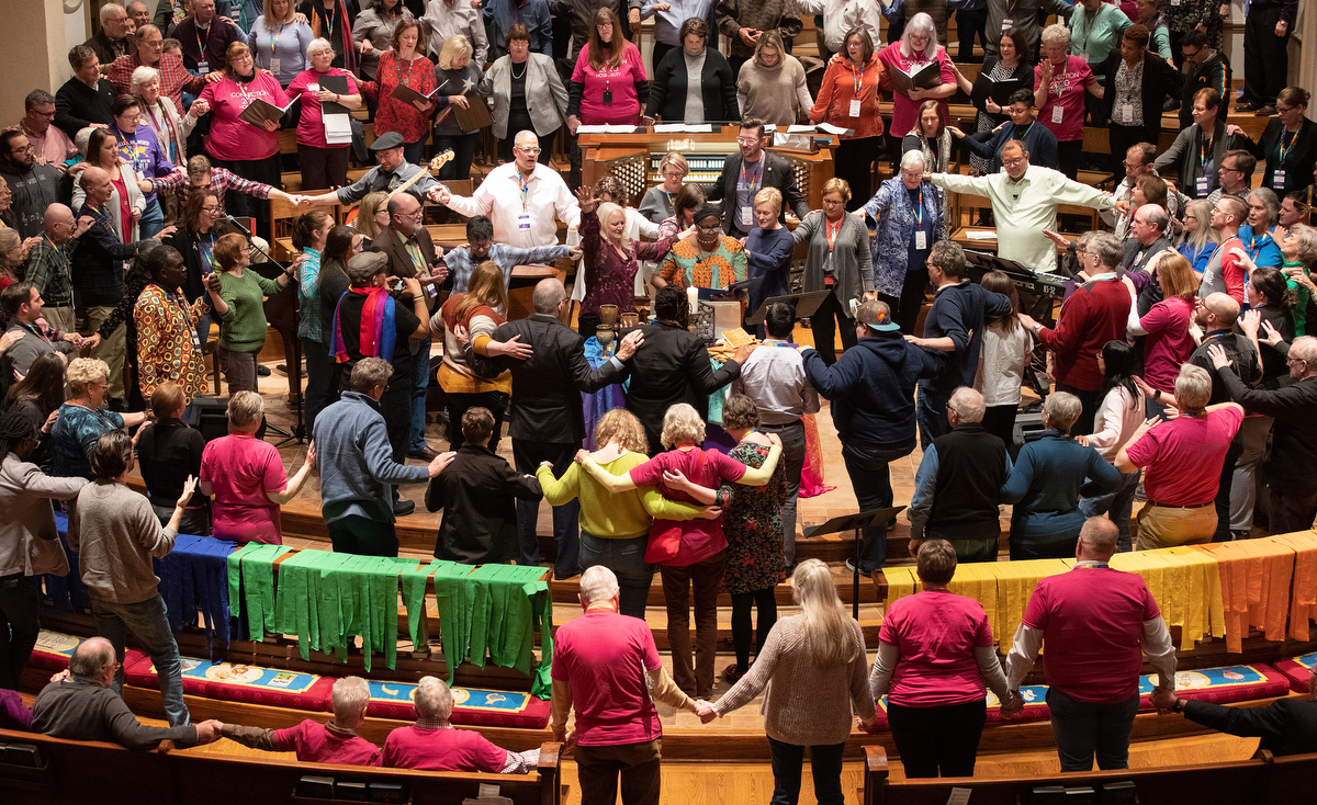 Attendees and guests of the Reconciling Ministries Network convocation pray together at the altar at Belmont United Methodist Church in Nashville, Tenn. LGBTQ United Methodists and their allies expressed hope that a proposal to separate the denomination might pave the way to end what they see as discrimination. Photo by Mike DuBose, UM News.