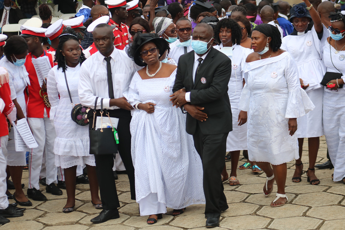 Family and friends of Bishop John K. Yambasu, (from left front) Elizabeth Yambasu, Emmanuel Yambasu, widow Millicent Yambasu and Alfred Lansana, arrive at the burial site on the campus of United Methodist University in Freetown, Sierra Leone. Photo by E Julu Swen, UM News. 