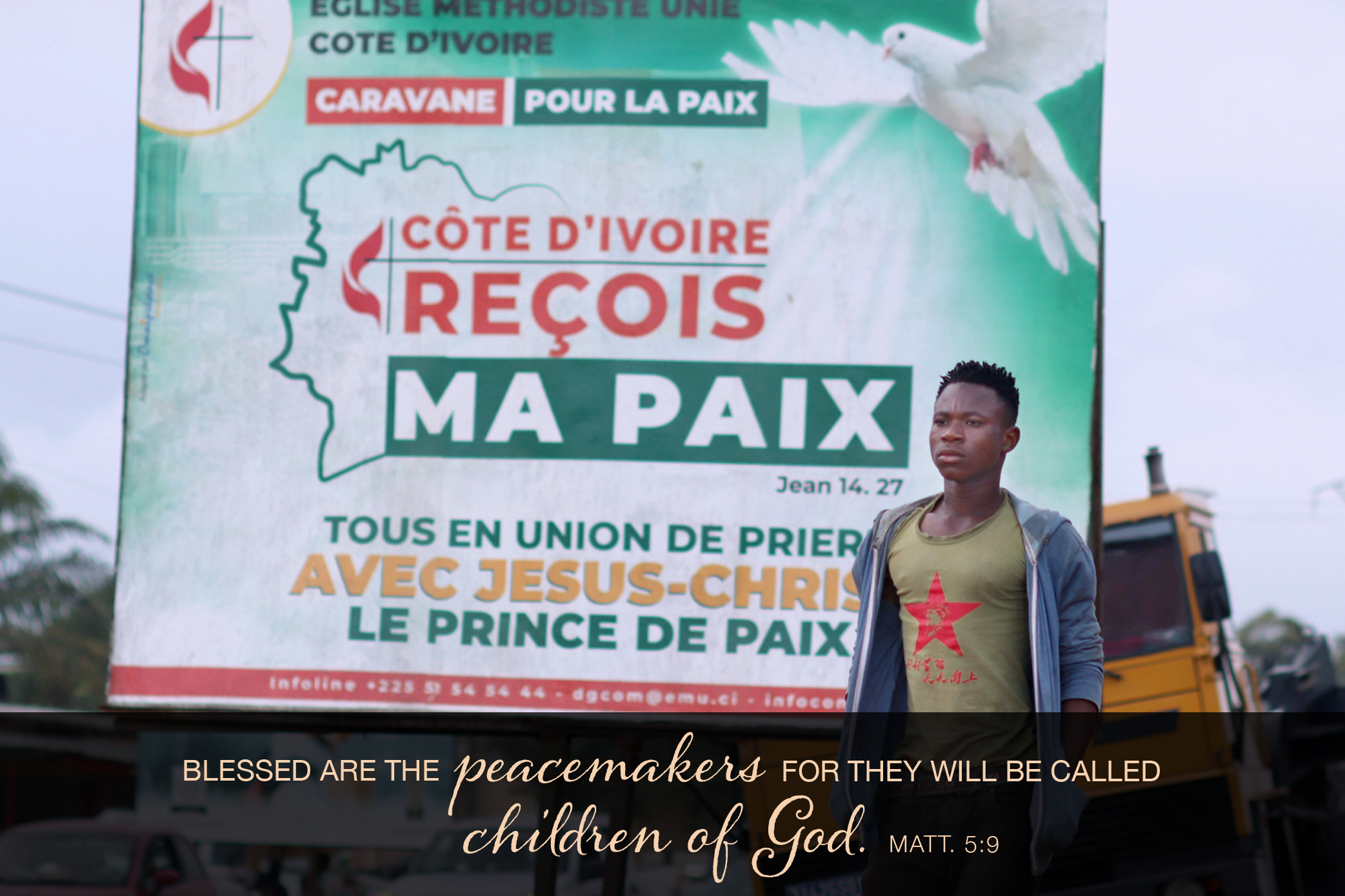 A pedestrian passes one of The United Methodist Church’s billboards calling for peace in the community of Abobo, Côte d’Ivoire. The United Methodist Church and its partners organized a communication campaign asking that the population and the authorities show restraint during the electoral period. The caravan crisscrossed several towns and hamlets in Côte d’Ivoire. Photo by Isaac Broune, UM News.