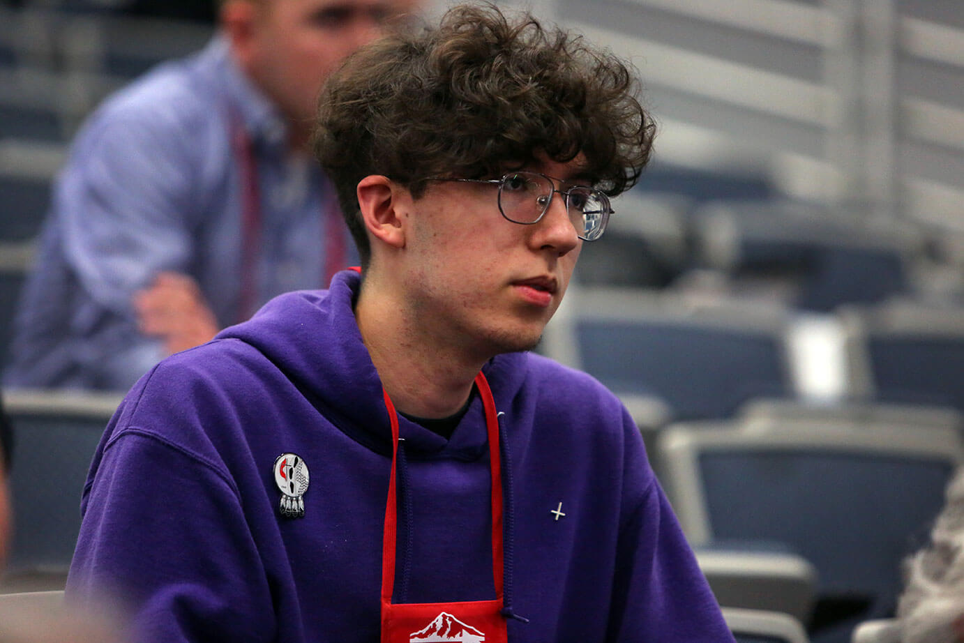 Nocona Williford, an Oklahoma Comanche and layperson in the Oklahoma Missionary Conference, watches the May 17 morning worship from the bleachers in the plenary hall of the 2016 United Methodist General Conference. Williford attends Hunting Horse United Methodist Church in Lawton, Okla.