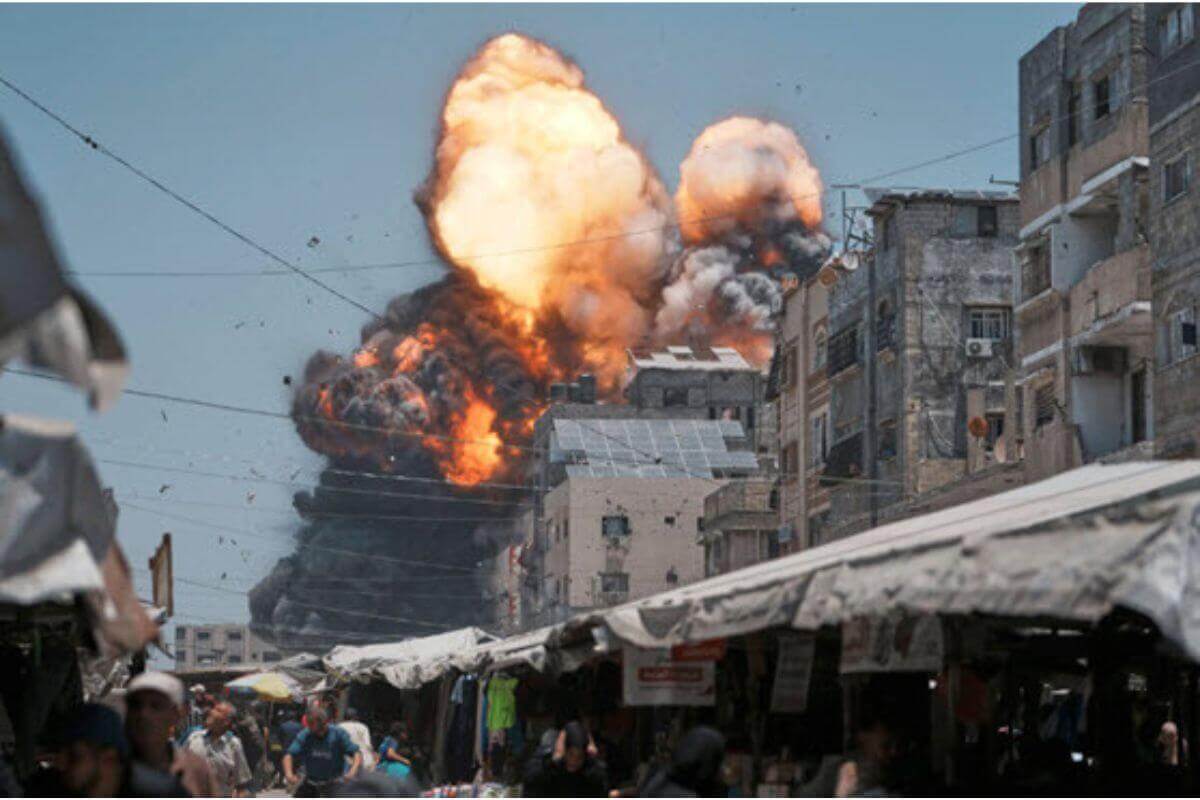 Multiple building explosions erupt during an Israeli bombing airstrike in Gaza City, Sunday, June 1, 2025. (Associated Press Photo/Jehad Alshrafi)